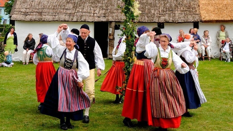 Dance around maypole, typical celebration of midsummer in Sweden, Tomelilla, SkÃ�ne, Sweden, Europe
