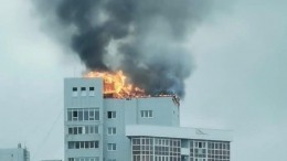 Видео: верхний этаж высотки жилого комплекса полыхает в Иркутске