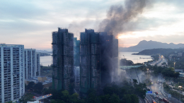 Число жертв пожара в Гонконге достигло 75 человек